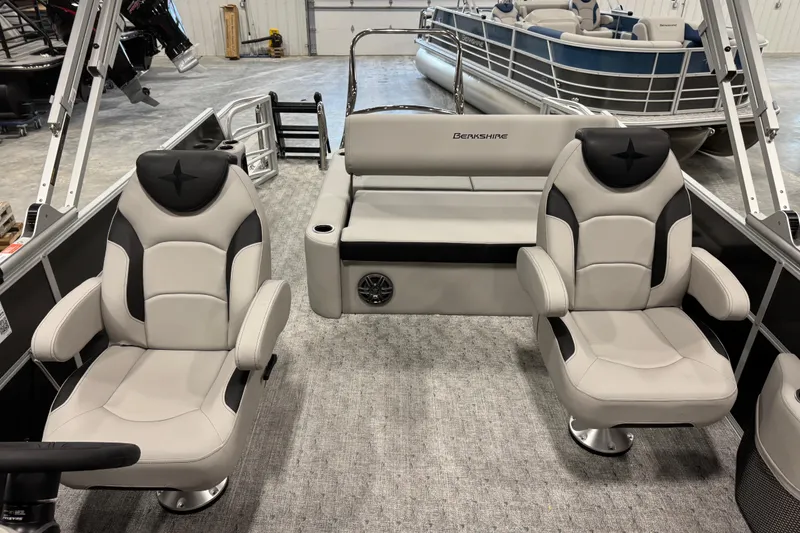 Slide: The Image of 2026 Berkshire 24 UL LE pontoon boat interior with plush seating and modern design. - 9