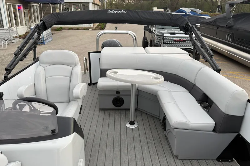 Slide: The Image of 2023 Bentley Pontoons Legacy 200 Cruise interior with plush seating and sleek design. - 11