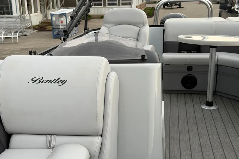Slide: The Image of 2023 Bentley Pontoons Legacy 200 Cruise interior with luxurious seating and sleek design. - 15