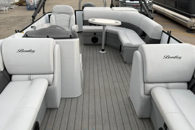 Slide: The Image of 2023 Bentley Pontoons Legacy 200 Cruise interior with luxurious seating and sleek design. - 16