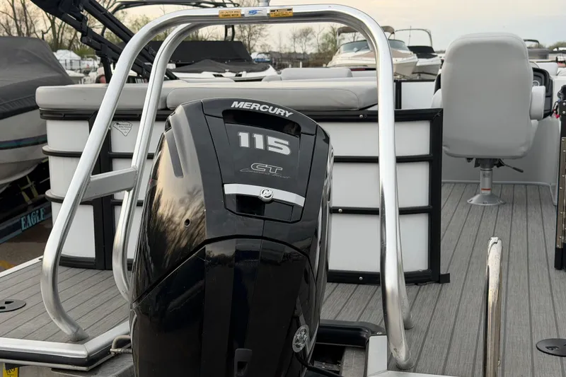Slide: The Image of 2023 Bentley Pontoons Legacy 200 Cruise with Mercury 115 engine, docked. - 5
