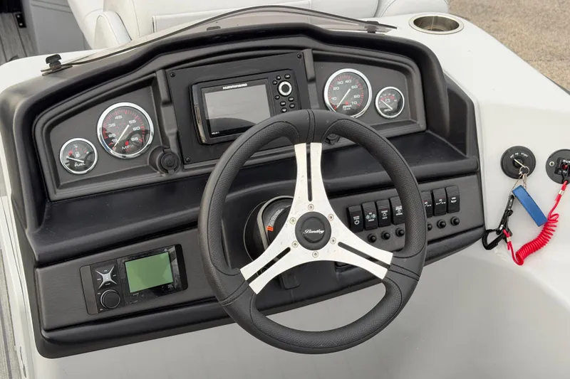 Slide: The Image of 2023 Bentley Pontoons Legacy 200 Cruise dashboard with steering wheel and control panel. - 8