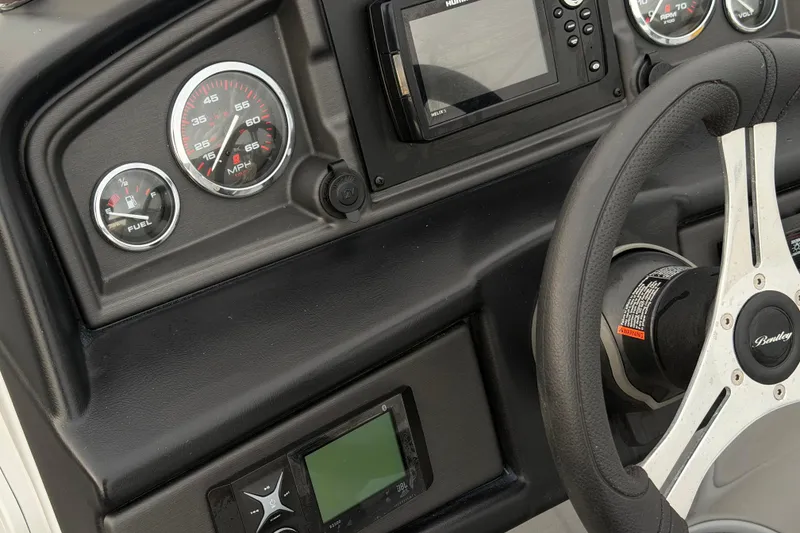 Slide: The Image of Dashboard of 2023 Bentley Pontoons Legacy 200 Cruise with steering wheel and gauges. - 9