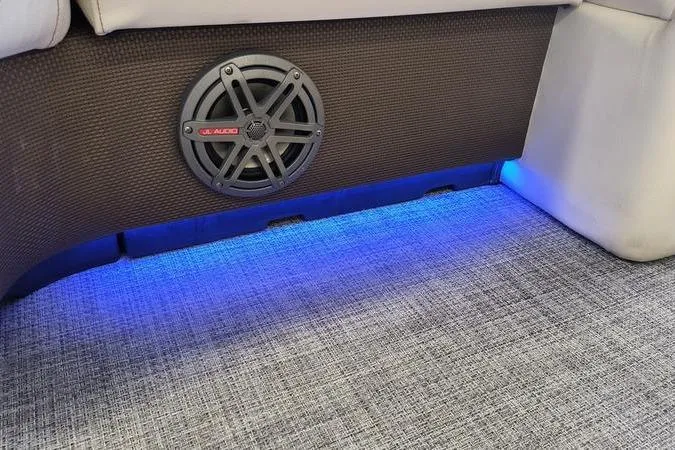 Slide: The Image of Speaker and blue LED lighting in 2017 Larson Escape 213 boat interior. - 20
