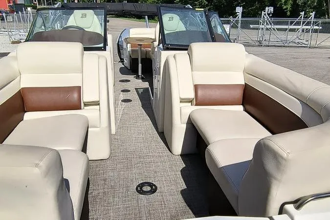 Slide: The Image of Interior view of 2017 Larson Escape 213 boat with beige and brown seating. - 21