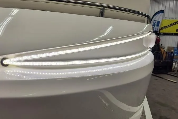 Slide: The Image of 2017 Larson Escape 213 boat with sleek LED lighting detail. - 22