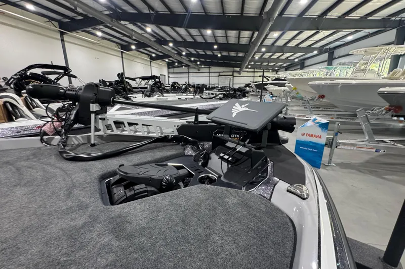 Slide: The Image of Manufacturer Provided Image: Two people fishing on a 2026 Skeeter FXR21 FLEX boat in a serene lake. - 14