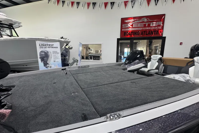 Slide: The Image of Manufacturer Provided Image: 2026 Skeeter FXR21 FLEX boat interior with advanced dashboard and steering wheel. - 17