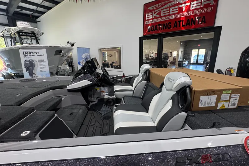 Slide: The Image of Manufacturer Provided Image: 2026 Skeeter FXR21 FLEX boat cockpit with advanced navigation and control systems. - 18