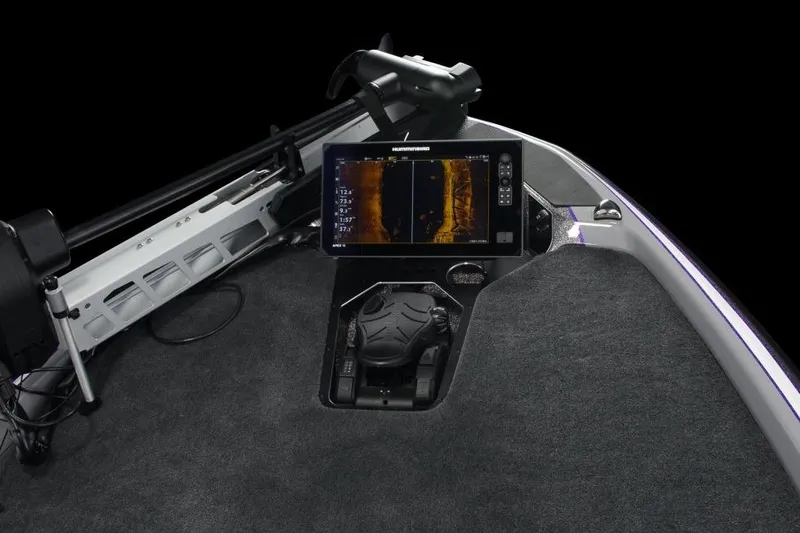 Slide: The Image of 2026 Skeeter FXR21 FLEX boat in showroom, featuring advanced navigation equipment. - 3