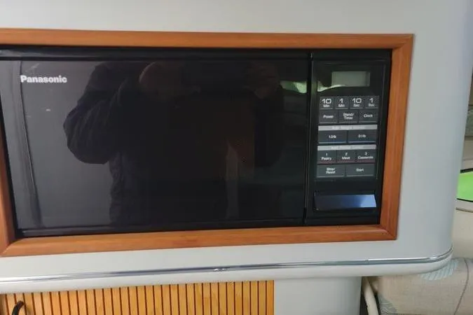 Slide: The Image of Panasonic microwave in 1991 Sea Ray 280 Weekender boat interior. - 16