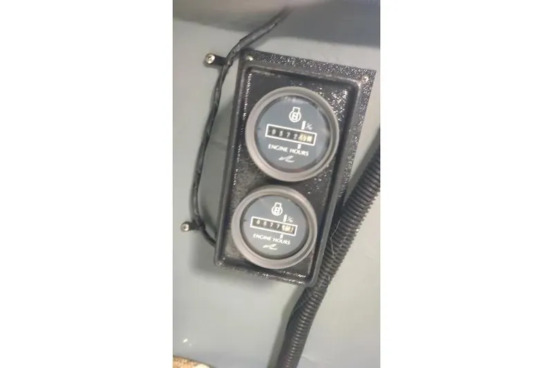 Slide: The Image of Engine hour meters on a 1991 Sea Ray 280 Weekender boat dashboard. - 20