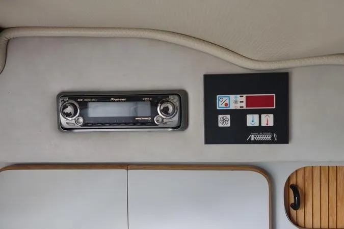 Slide: The Image of 1991 Sea Ray 280 Weekender interior with Pioneer stereo and control panel. - 8