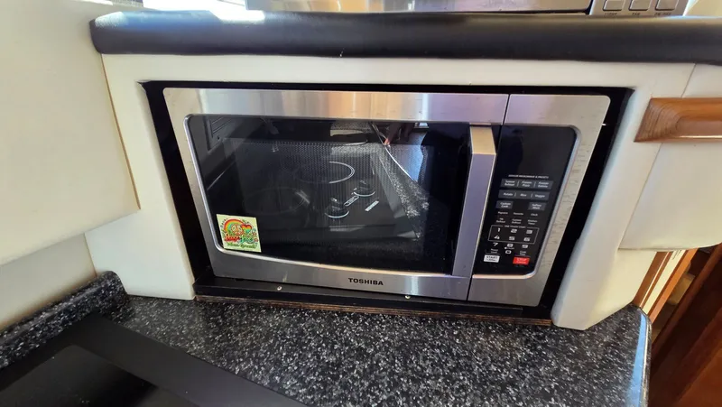 Slide: The Image of Toshiba microwave in 2000 Carver 450 Voyager Pilothouse kitchen. - 21