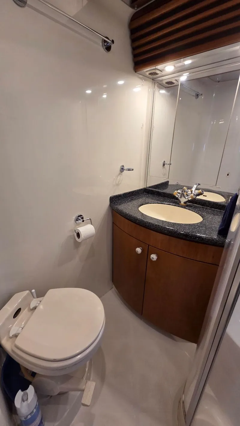 Slide: The Image of Bathroom in 2000 Carver 450 Voyager Pilothouse with sink and toilet. - 32