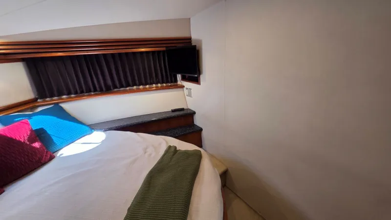 Slide: The Image of Interior of 2000 Carver 450 Voyager Pilothouse with bed and TV. - 37