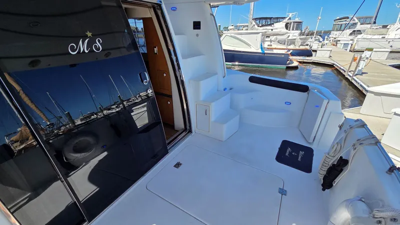 Slide: The Image of Carver 450 Voyager Pilothouse 2000, yacht deck at marina. - 41