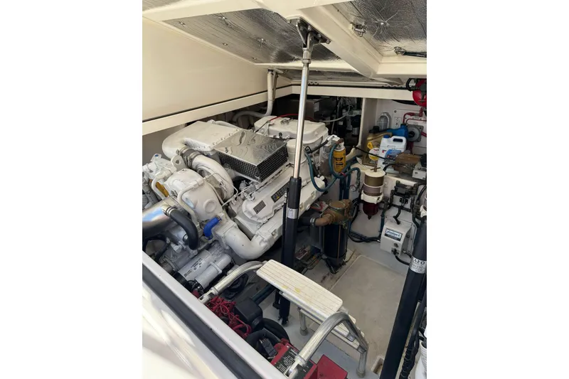 Slide: The Image of Engine room of a 1998 Cabo Yachts 35 Express, showcasing mechanical components and equipment. - 46