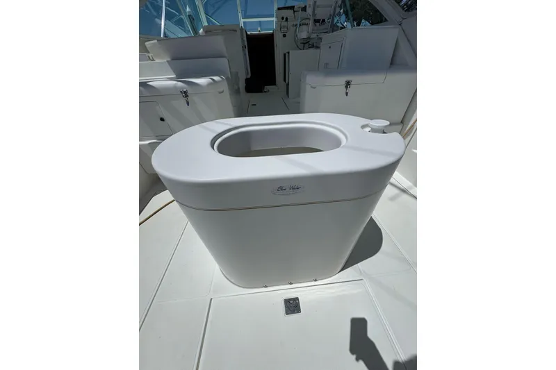 Slide: The Image of 1998 Cabo Yachts 35 Express interior with white seating and helm station. - 51
