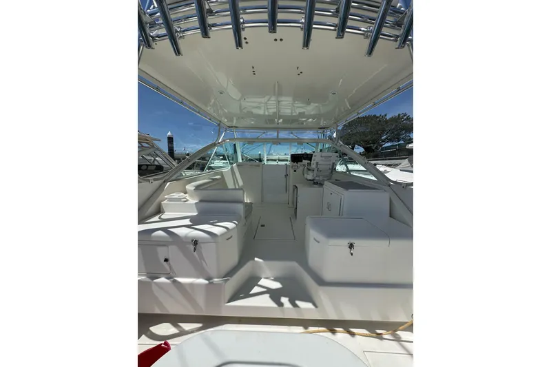 Slide: The Image of 1998 Cabo Yachts 35 Express boat interior with seating and helm station. - 60