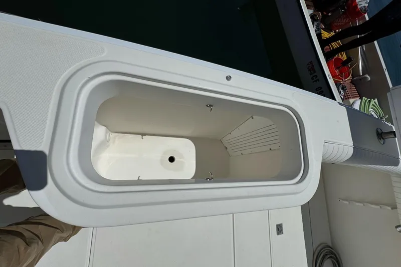 Slide: The Image of Open storage compartment on a 1998 Cabo Yachts 35 Express boat deck. - 66