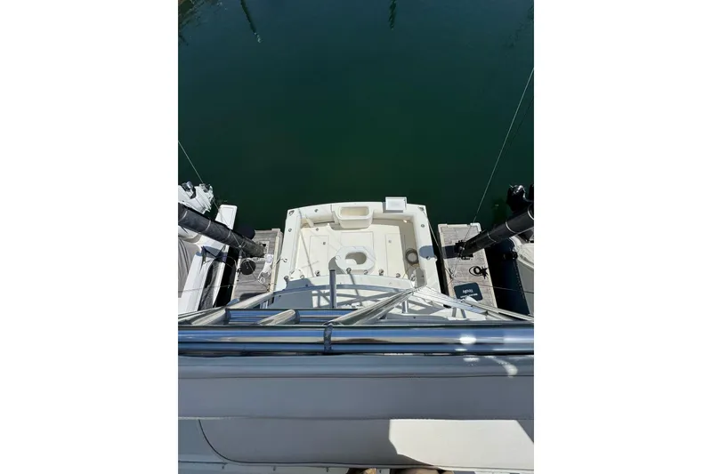 Slide: The Image of 1998 Cabo Yachts 35 Express boat deck view at marina. - 67