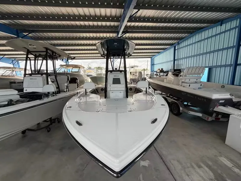 Slide: The Image of 2026 Pathfinder 2200 TRS boat in covered warehouse. - 11
