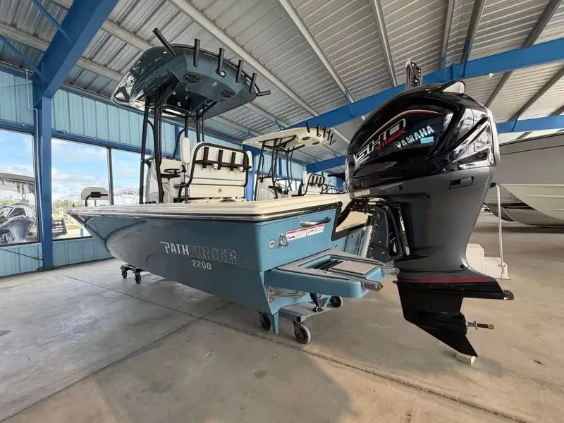 Slide: The Image of 2026 Pathfinder 2200 TRS boat with Yamaha engine in warehouse. - 3