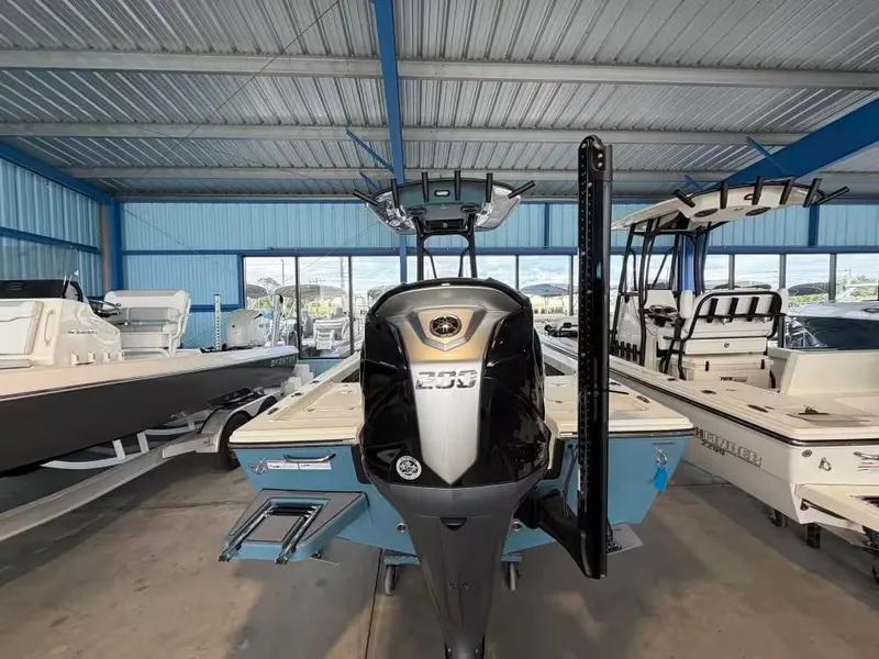 Slide: The Image of 2026 Pathfinder 2200 TRS boat in a storage facility. - 5