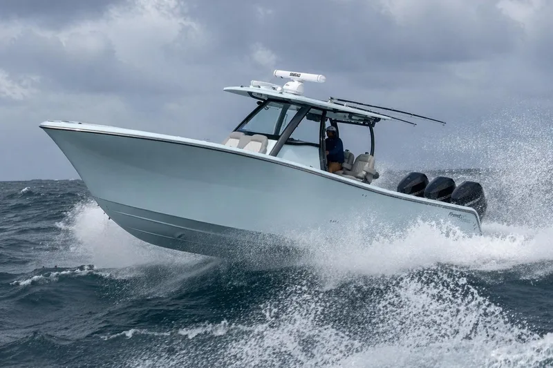 The Image of 2024 Front Runner boat navigating rough seas with powerful engines and sleek design. - 0