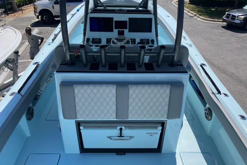 Slide: The Image of 2024 Front Runner boat interior with control panel and rod holders. - 8