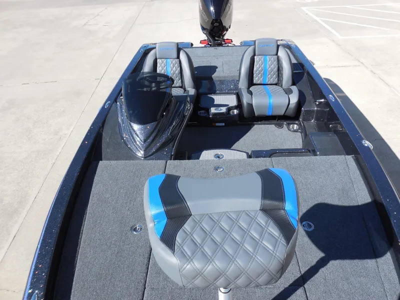 Slide: The Image of Caymas CX 201 PRO 2027: Modern design with gray and blue seats, spacious deck, powerful outboard motor. - 17