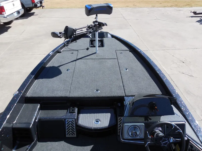 Slide: The Image of The image shows the deck of a 2027 Caymas CX 201 PRO boat with gray carpeting. - 15