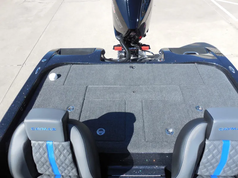 Slide: The Image of The image shows the cockpit of a Caymas CX 201 PRO boat with gray seats and blue accents. - 20