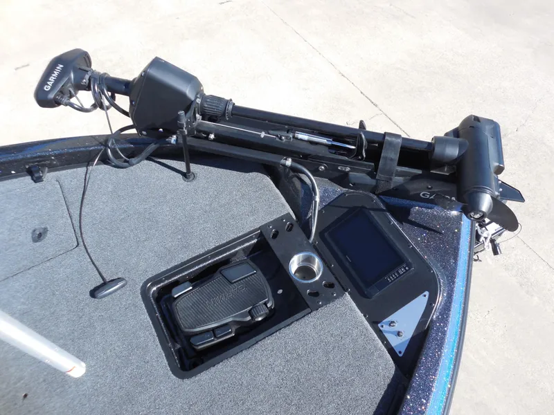 Slide: The Image of The image shows the deck of a Caymas CX 201 PRO boat with a Garmin trolling motor and control pedal. - 16