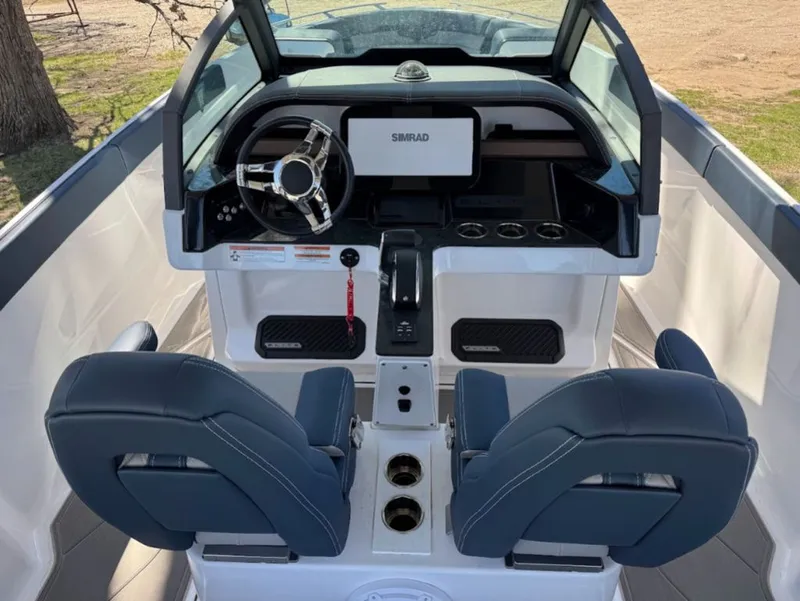 Slide: The Image of Interior of 2025 Monterey Elite 27 OB with modern helm console. - 5