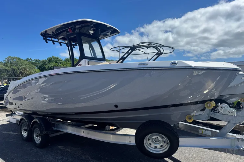 The Image of 2026 Yamaha Boats 255 FSH Sport E on trailer under blue sky. - 0