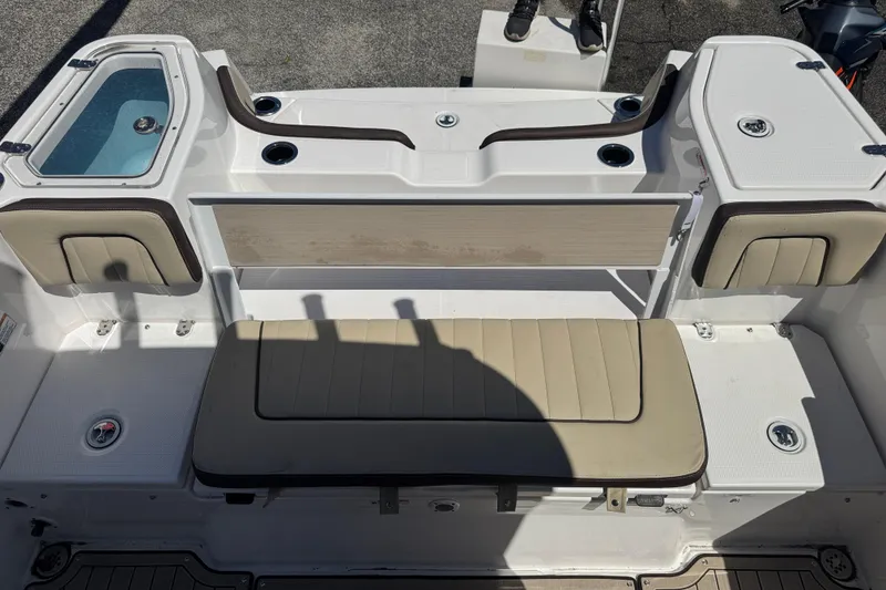 Slide: The Image of 2026 Yamaha Boats 255 FSH Sport E interior with seating and storage compartments. - 28