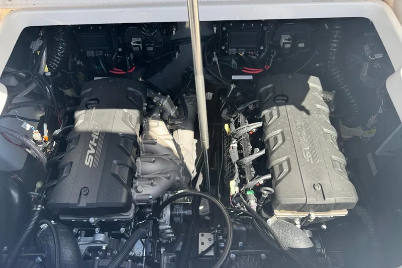 Slide: The Image of Engine compartment of 2026 Yamaha Boats 255 FSH Sport E, showcasing dual engines. - 32