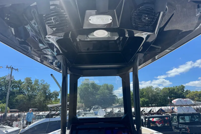 Slide: The Image of 2026 Yamaha Boats 255 FSH Sport E interior view with speakers and lighting. - 5