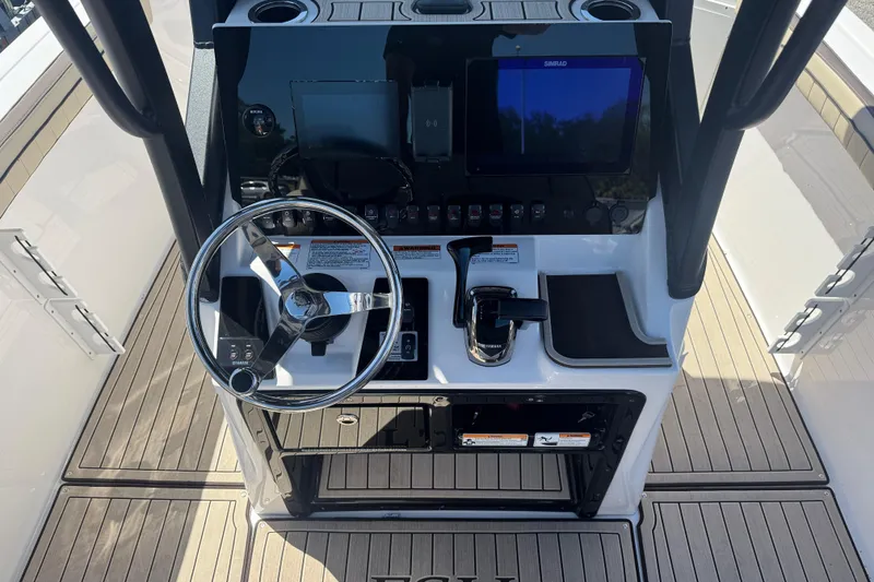 Slide: The Image of 2026 Yamaha Boats 255 FSH Sport E dashboard with steering wheel and controls. - 6