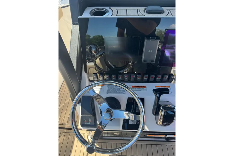 Slide: The Image of Steering console of 2026 Yamaha Boats 255 FSH Sport E with modern controls. - 9