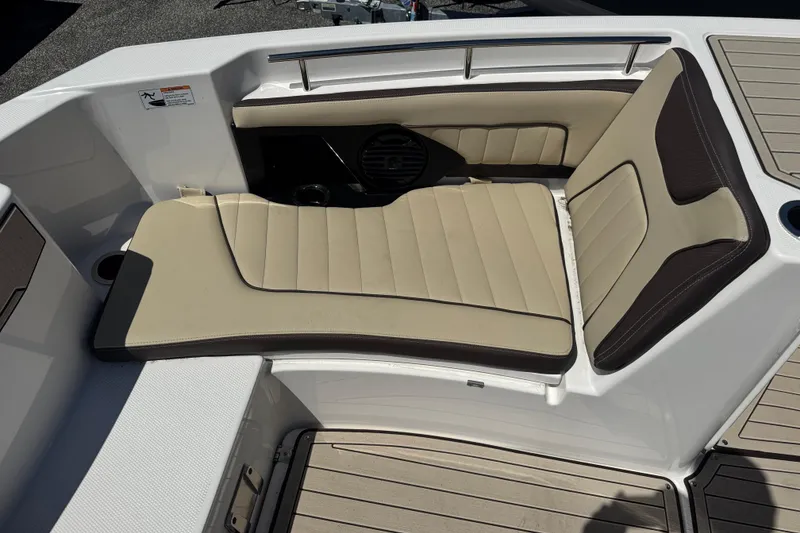Slide: The Image of 2026 Yamaha Boats 255 FSH Sport E, beige and brown cushioned seating area. - 18