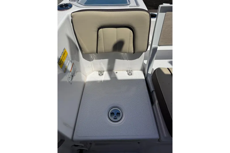 Slide: The Image of 2026 Yamaha Boats 255 FSH Sport E interior seating detail with beige upholstery. - 30