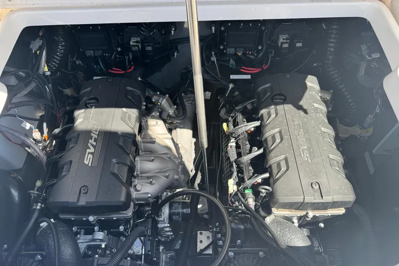 Slide: The Image of Engine compartment of 2026 Yamaha Boats 255 FSH Sport E, showcasing dual engines. - 32