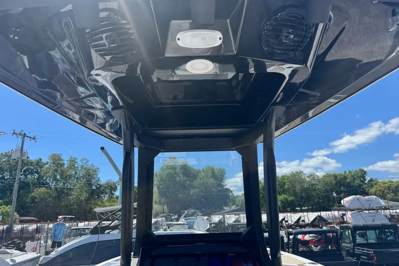 Slide: The Image of 2026 Yamaha Boats 255 FSH Sport E interior view with speakers and lighting. - 5