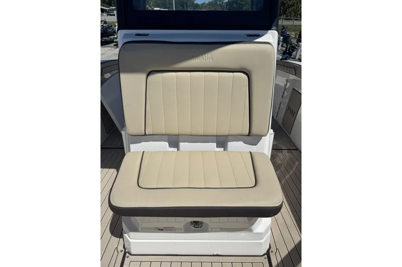 Slide: The Image of 2026 Yamaha Boats 255 FSH Sport E, beige cushioned seating detail. - 21