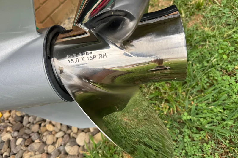 Slide: The Image of Close-up of a shiny boat propeller on a 2024 Regency 230 DL3. - 10