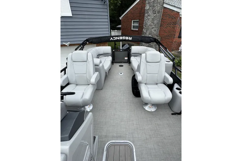 Slide: The Image of 2024 Regency 230 DL3 boat interior with luxurious seating and modern design. - 13