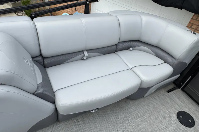 Slide: The Image of 2024 Regency 230 DL3 boat interior with luxurious gray seating and modern design. - 22